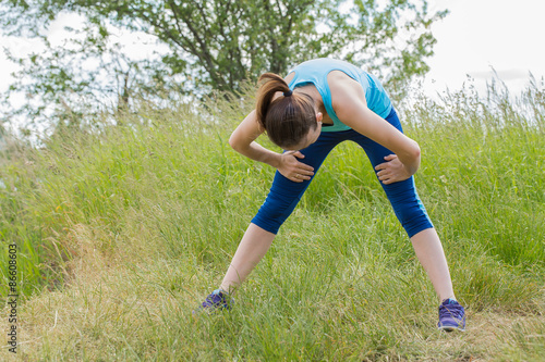 Woman stays outdoor in the morning sport workout.
