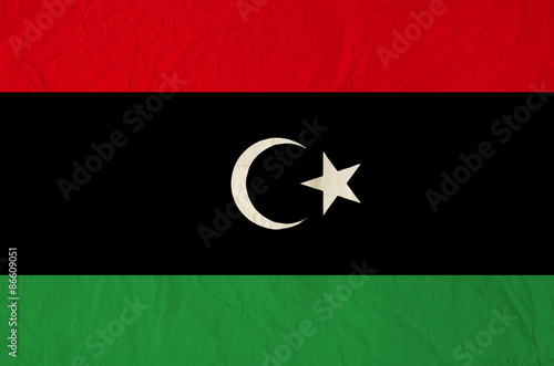 Flag of Libya with old vintage paper texture background