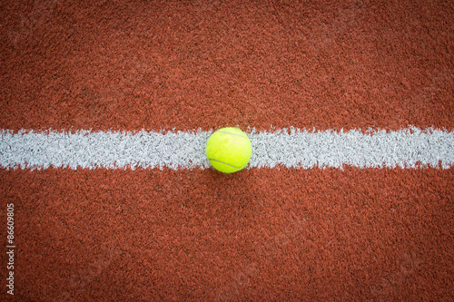 Tennis ball on line of court © mrstam