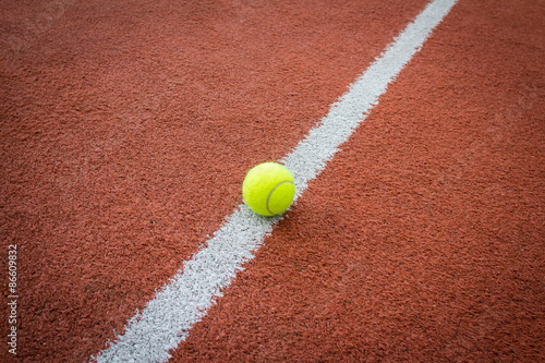 Tennis ball on line of court © mrstam