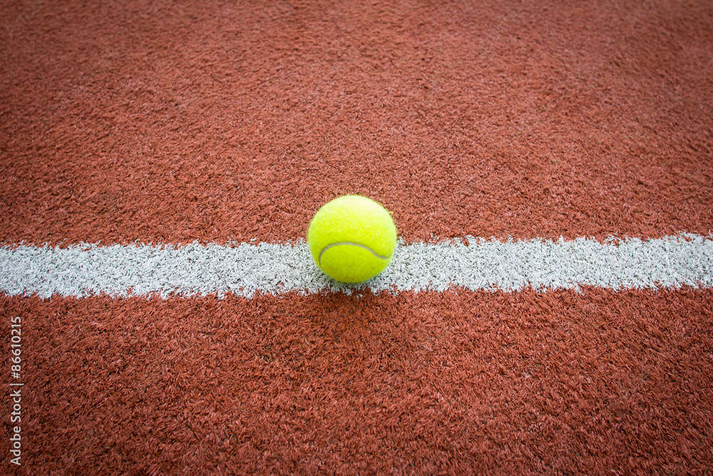 Tennis ball on line of court