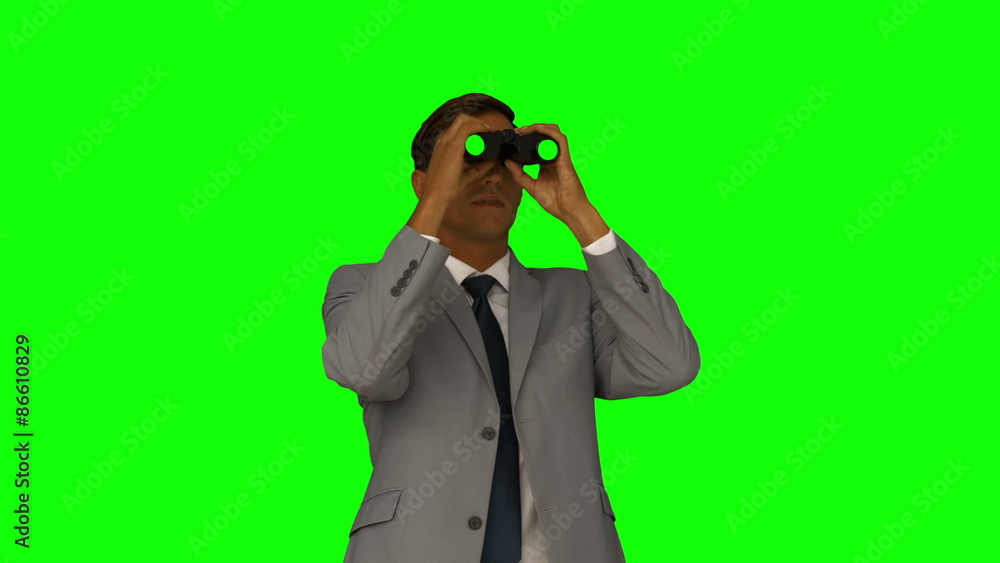 Businessman looking through binoculars Businessman looking through binoculars
