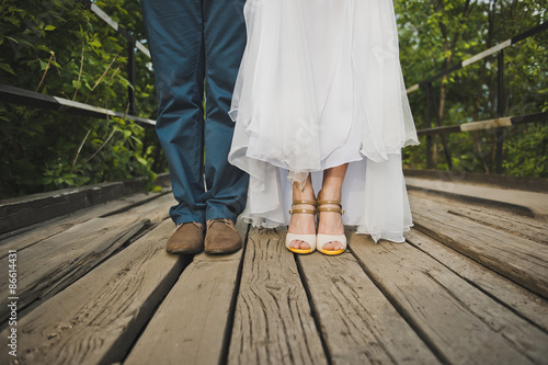 Feet of the newly-married couple on bridge boards 3080.