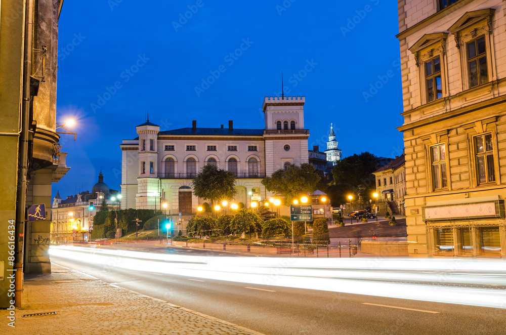 Night traffic on main Zamkowa street in front of Sulkowski Castle