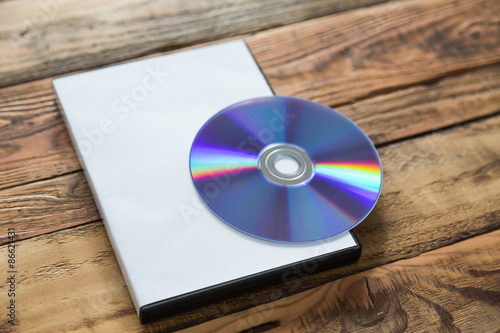 Photography Blank compact disc with cover on wood background ground
