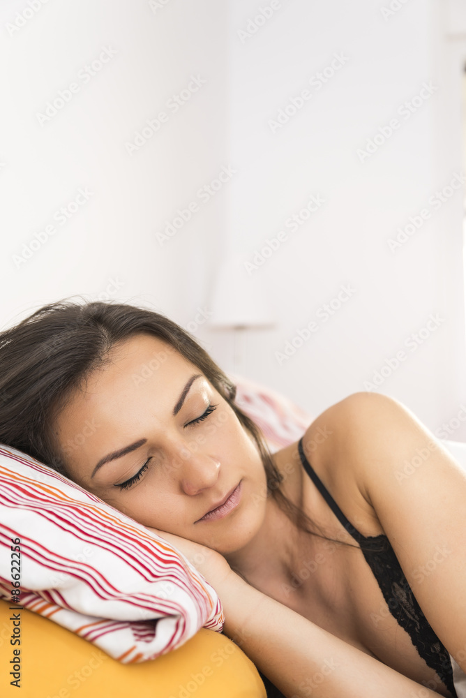 Portrait of the beautiful young woman sleeping in white bed Portrait of the beautiful young woman sleeping in white bed