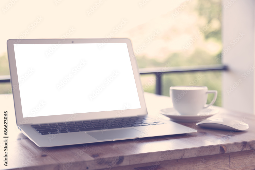laptop with coffee cup on old wooden table ( Filtered image proc laptop with coffee cup on old wooden table ( Filtered image proc