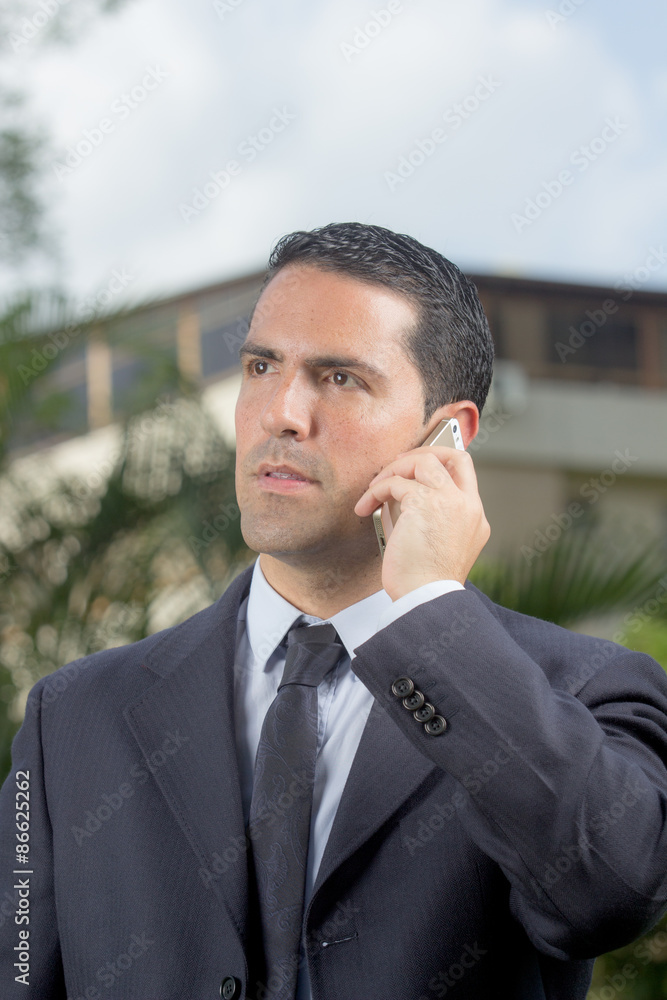 Portrait Of Young Latin Businessman Using Cell Phone Portrait Of Young Latin Businessman Using Cell Phone