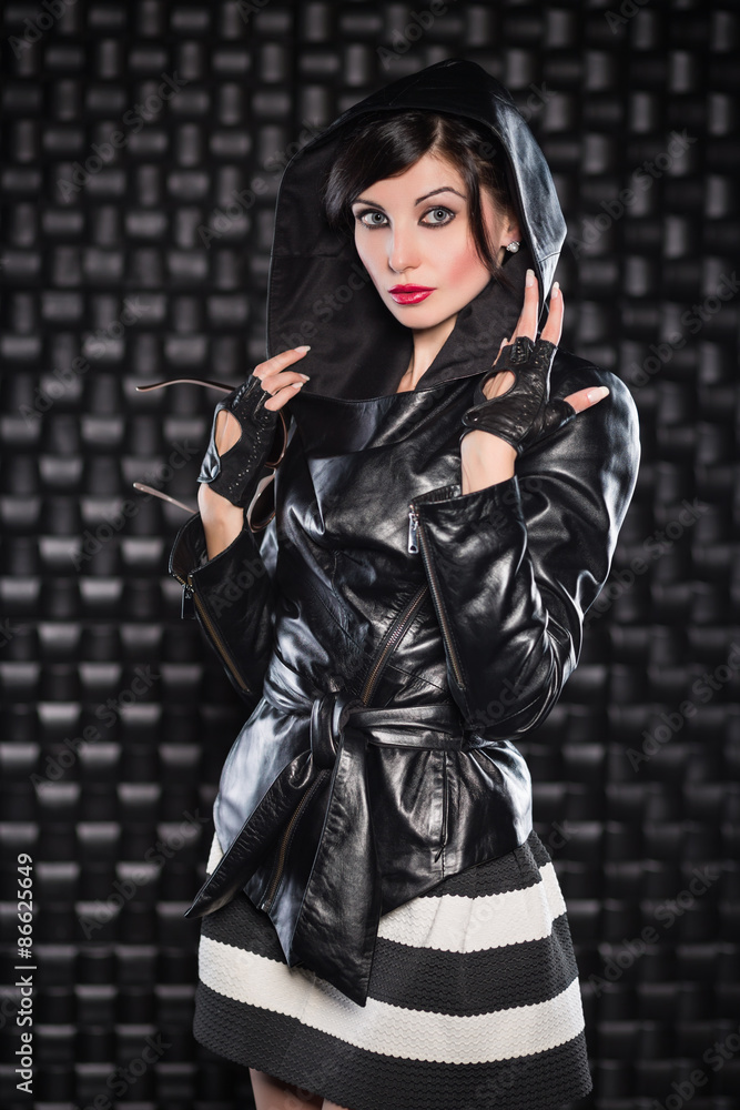 Fototapeta premium Beautiful brunette posing in black jacket