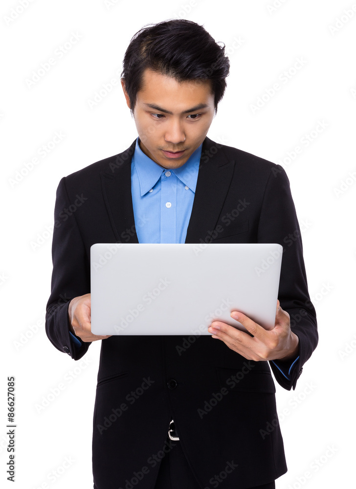 Young businessman use of the laptop computer Young businessman use of the laptop computer