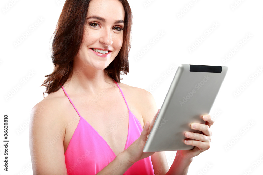 woman smiling while playing on her tablet woman smiling while playing on her tablet