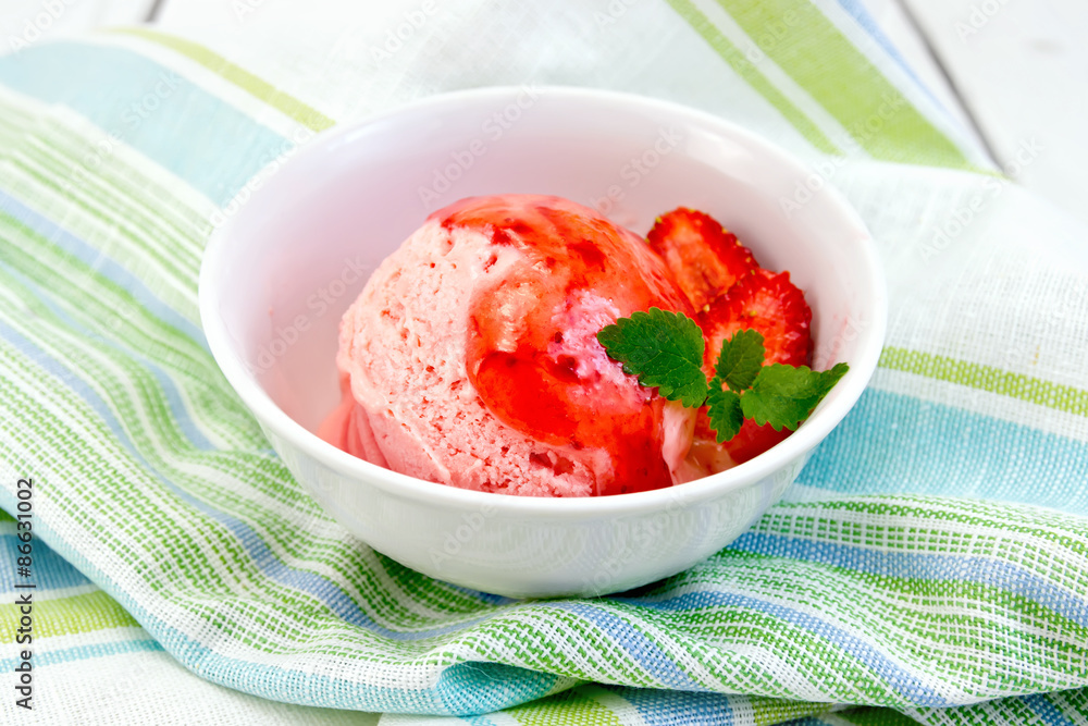 Ice cream strawberry with syrup in bowl on napkin Ice cream strawberry with syrup in bowl on napkin