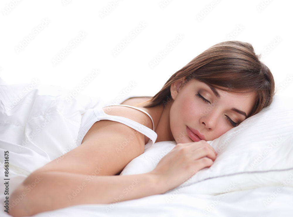 Beautiful girl sleeps in the bedroom, lying on bed Beautiful girl sleeps in the bedroom, lying on bed