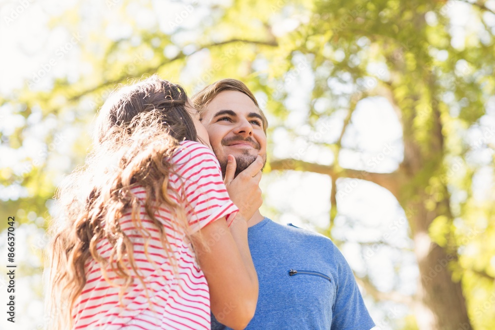 Cute couple kissing in the park Cute couple kissing in the park