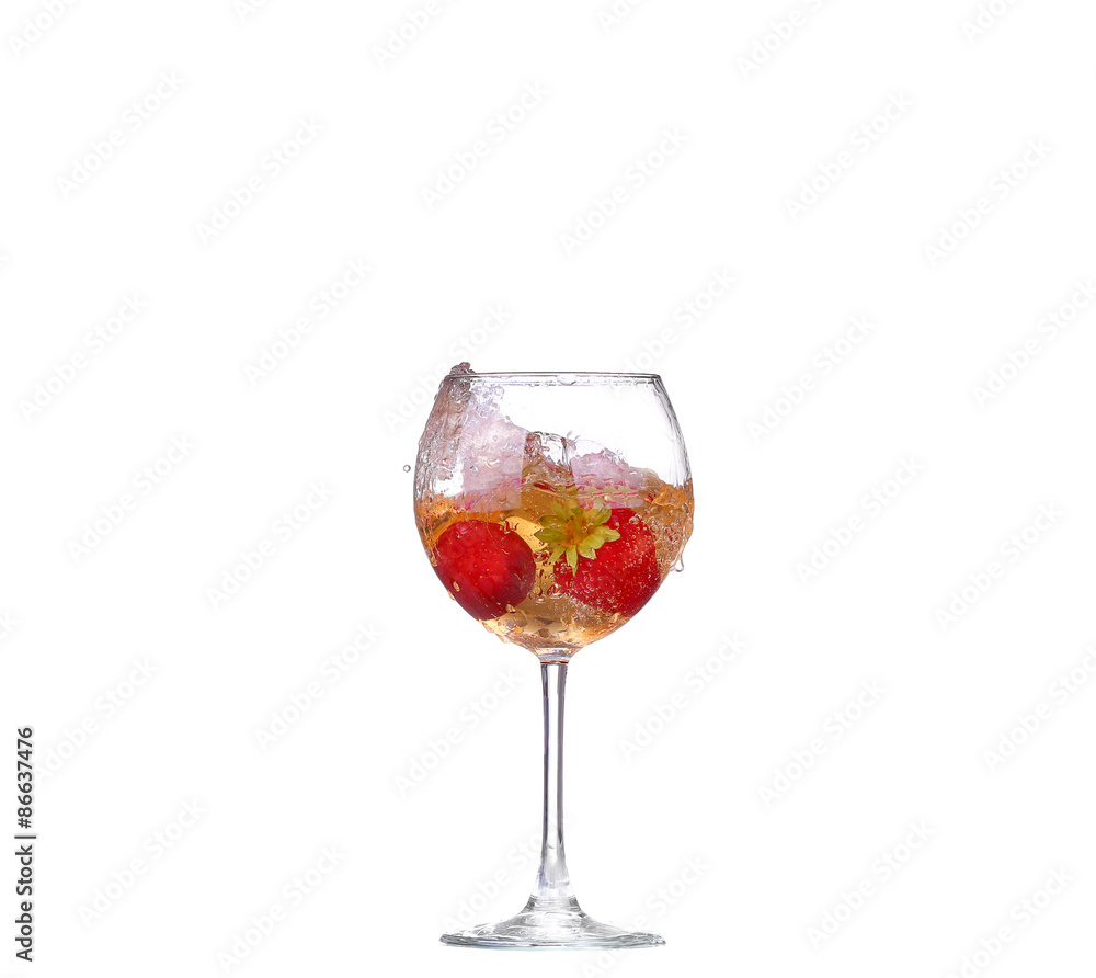Single Strawberry splashing into a glass of wine Single Strawberry splashing into a glass of wine