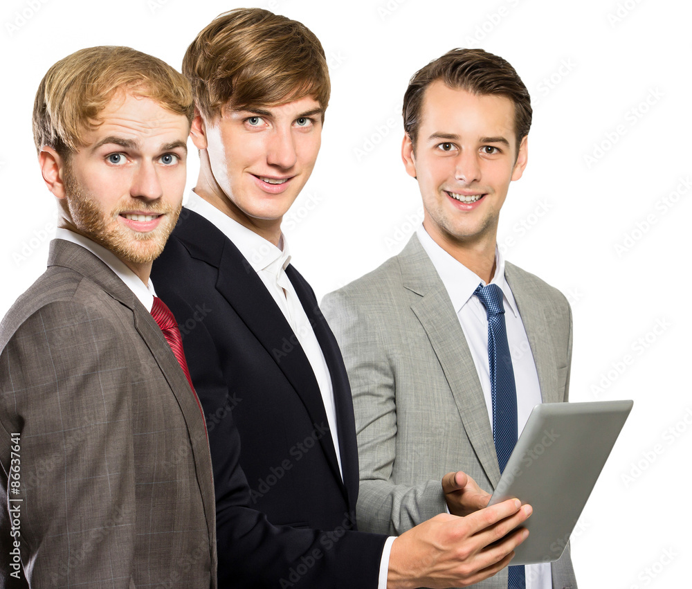 three co-workers meeting and looking at camera three co-workers meeting and looking at camera
