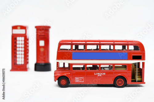 Postbox and red telephone box with red bus 