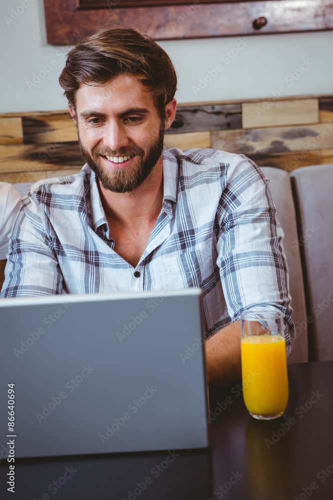 young man working on his computer