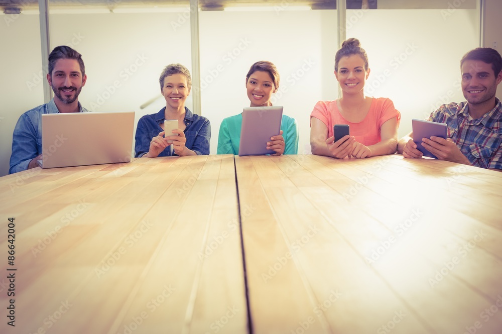 Fototapeta premium Creative colleagues with laptop and digital tablet