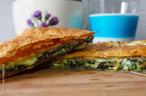 Healthy breakfast - cheese and spinach pie and milk