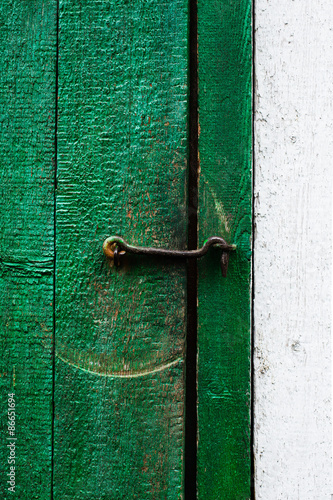 Metal hook in old wooden door