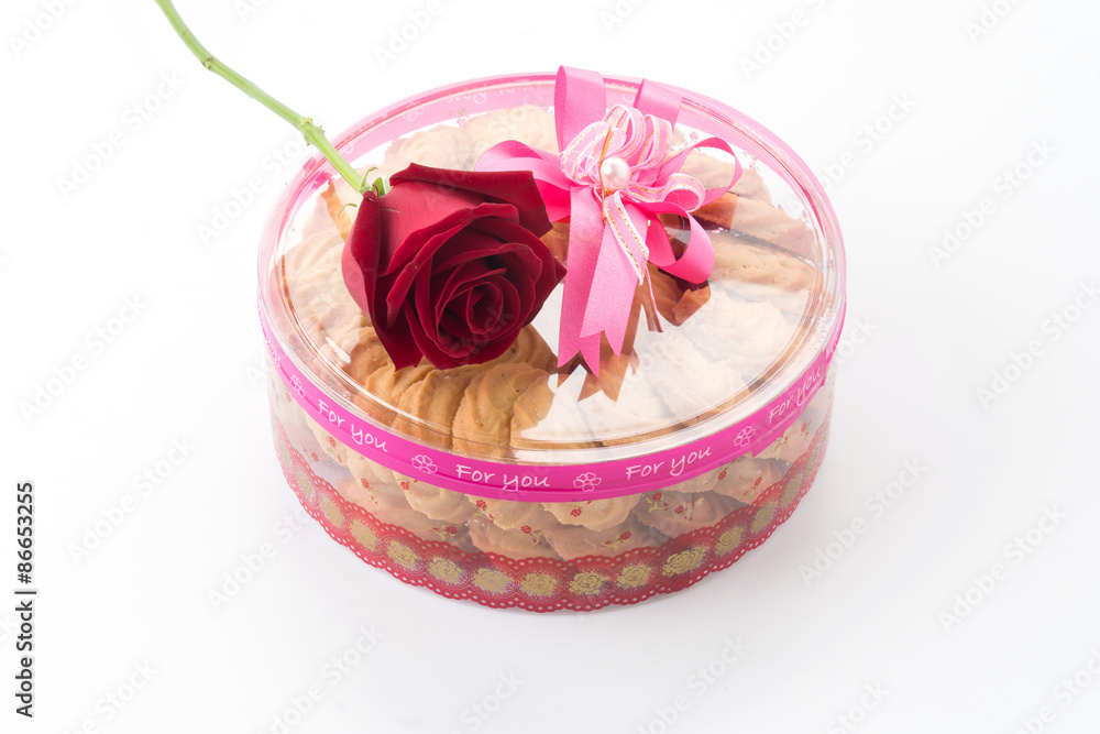 Naklejka premium cookie and rose on white background