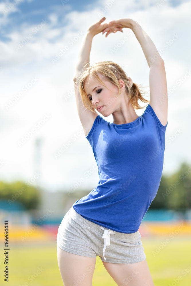 Fitness woman exercising outdoors Fitness woman exercising outdoors