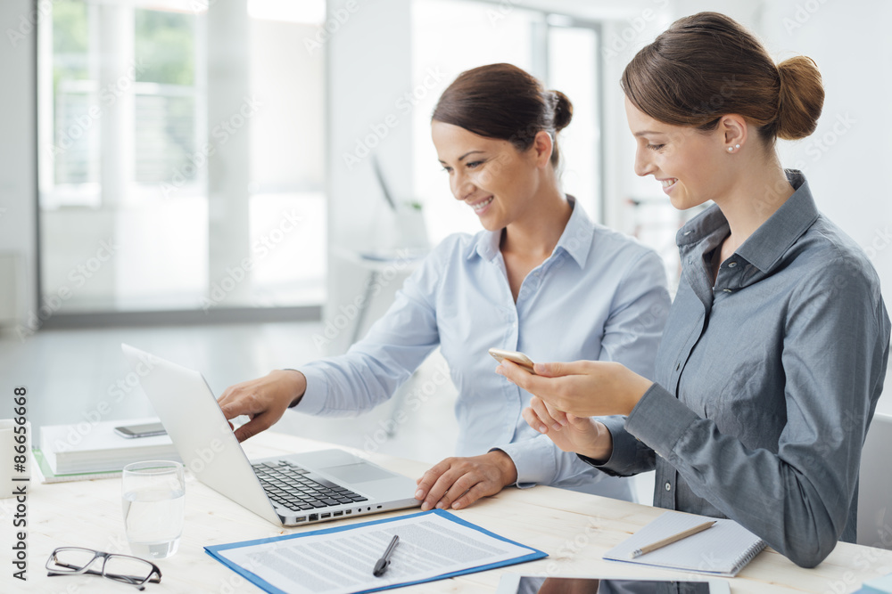 Business women working together on a laptop Business women working together on a laptop