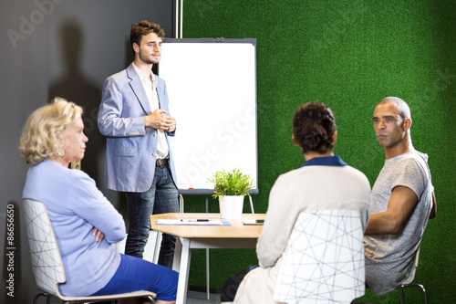 Businesspeople Discussing At Office Lobby