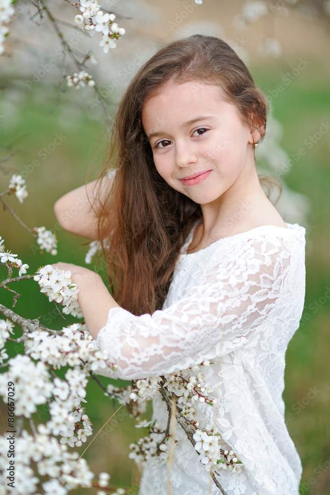 portrait of a beautiful little girl with flowers portrait of a beautiful little girl with flowers