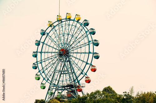 Fotografie Amusement park ferris wheel in the sky
