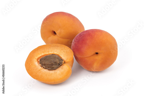 Fresh ripe organic apricots isolated on a white background