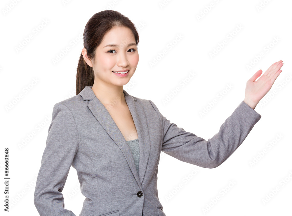 Asian Businesswoman showing the open hand palm Asian Businesswoman showing the open hand palm