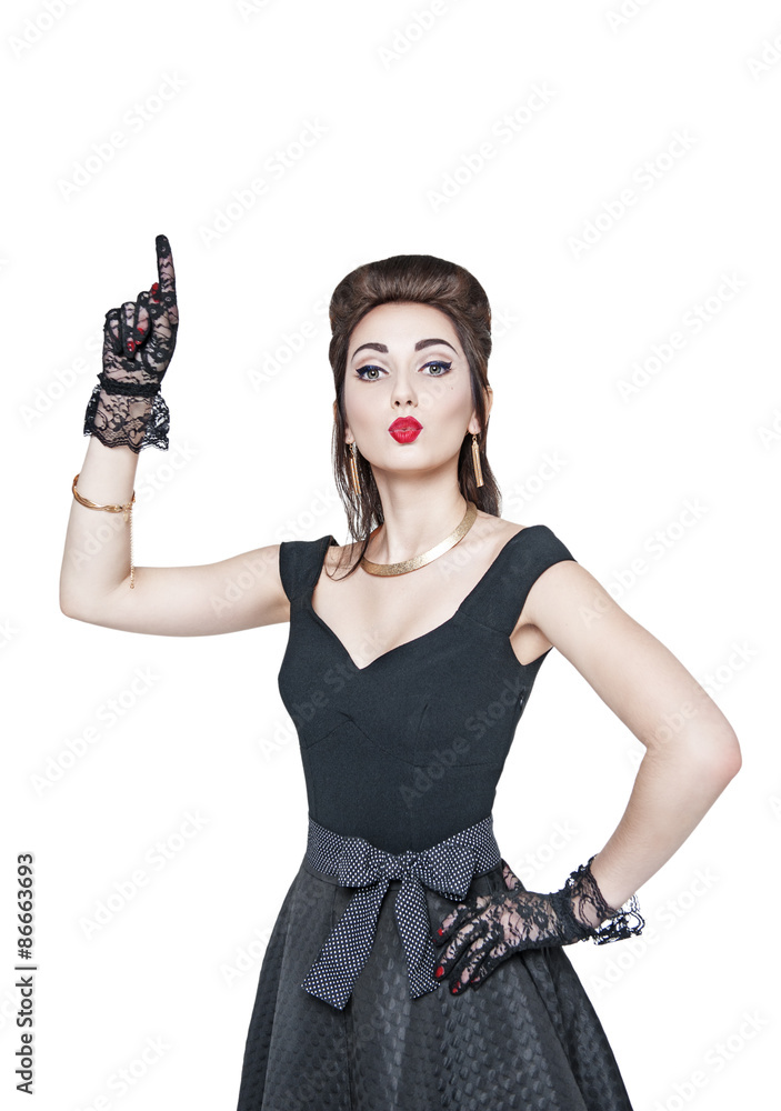 Beautiful woman in retro pin up style showing on something by fi Beautiful woman in retro pin up style showing on something by fi