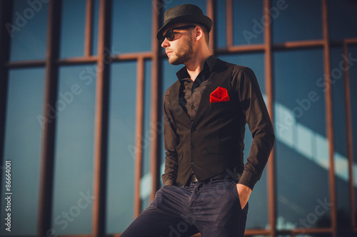 stylish sexy handsome man in in fashionable clothes lifestyle in