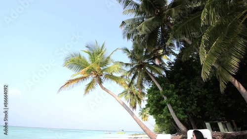 Woman is relaxing at tropical beach, South Male Atoll. Maldives photo