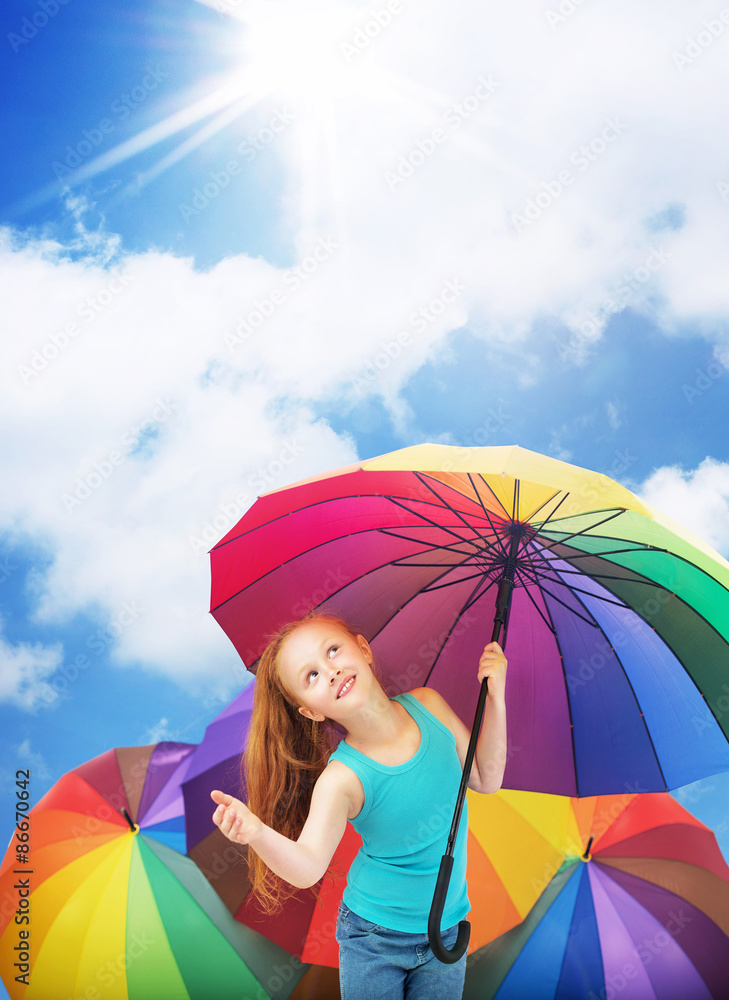 Redhead girl holding an umbrella