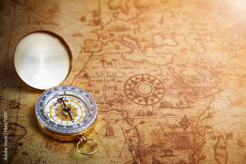 Retro compass on ancient world map, vintage style