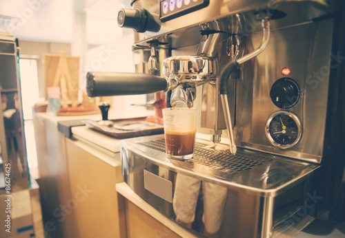 Hot espresso on the coffeee machine