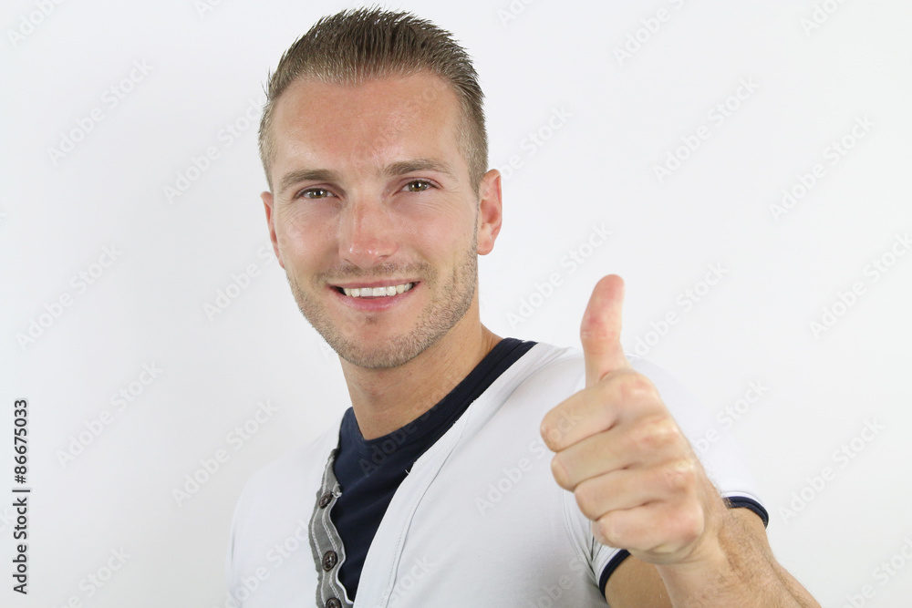 Handsome blond hair man holds his thumbs up Handsome blond hair man holds his thumbs up