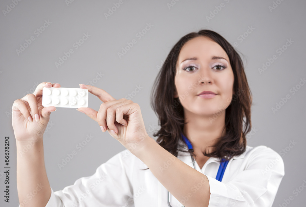 Medical Concept: Professional Female Caucasian Doctor Holding an Medical Concept: Professional Female Caucasian Doctor Holding an