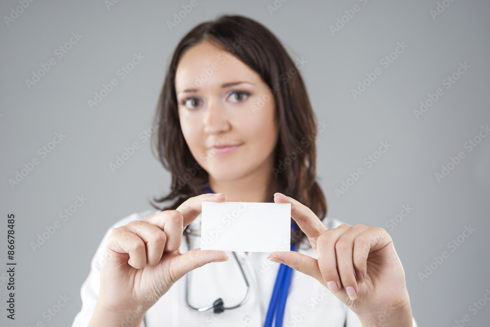 Portrait of Medical Female Doctor Presenting and Showing White C Portrait of Medical Female Doctor Presenting and Showing White C