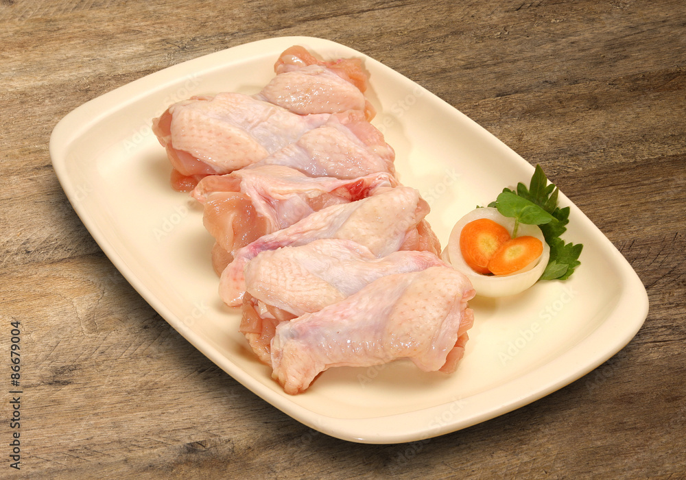 Fresh chicken parts, wings, legs, meat in ice cube trays. Fresh chicken parts, wings, legs, meat in ice cube trays.