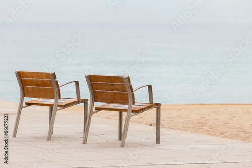 empty chairs on the beach © Maksim Shebeko