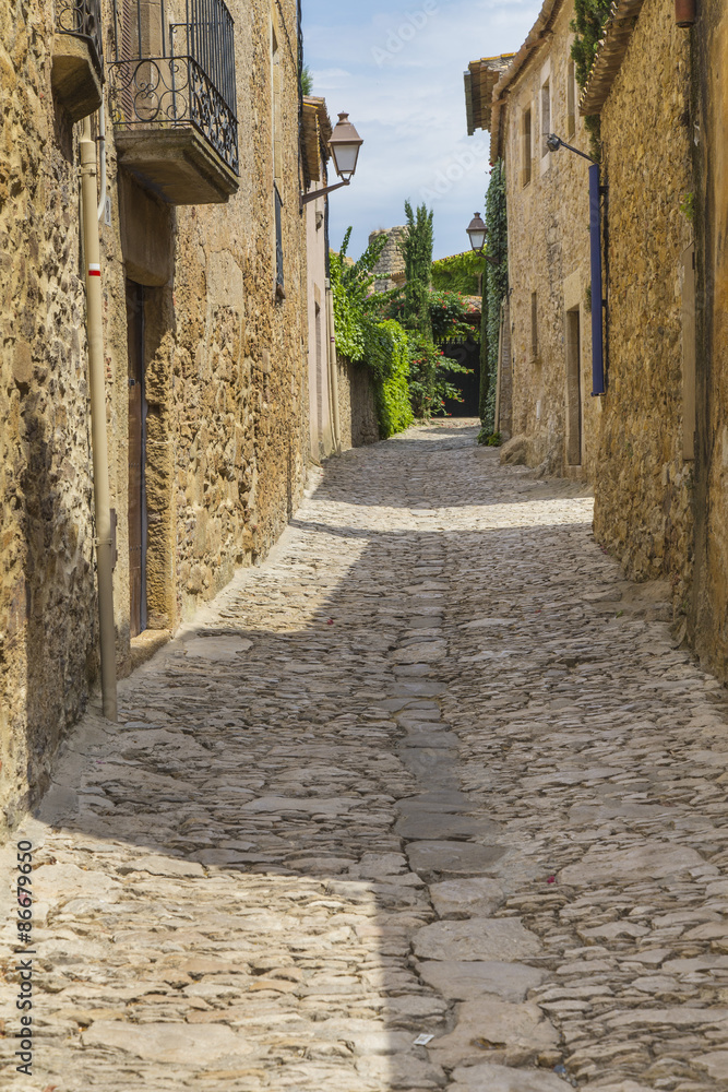 Cobble stone street path in Peretallada, Catalonia.