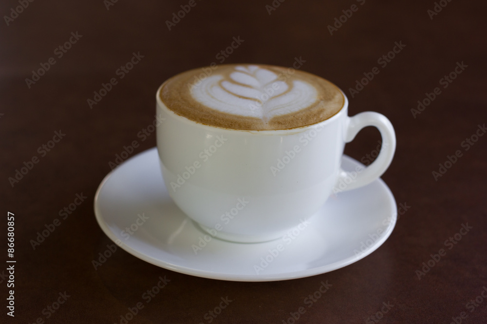 Fototapeta premium Cup of art latte or cappuccino coffee.