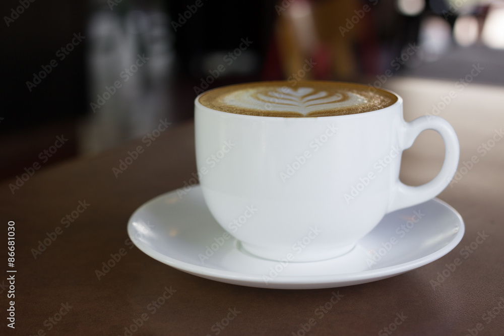 Obraz premium Cup of art latte or cappuccino coffee.