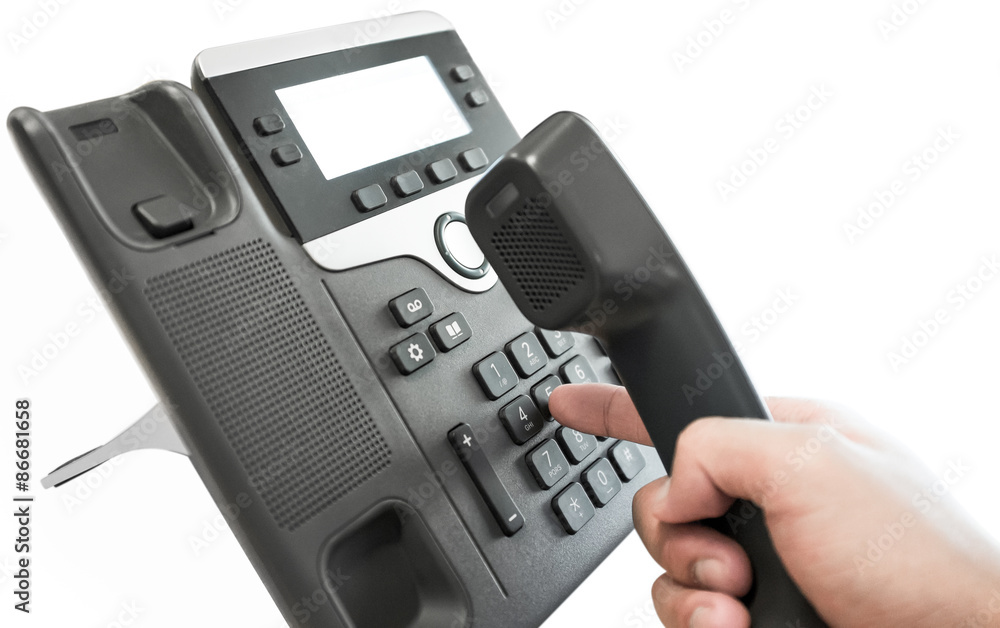 One human hand pressing key on phone with white background. One human hand pressing key on phone with white background.