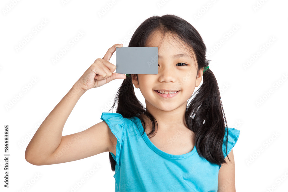 Little asian girl smile with a blank gray card Little asian girl smile with a blank gray card