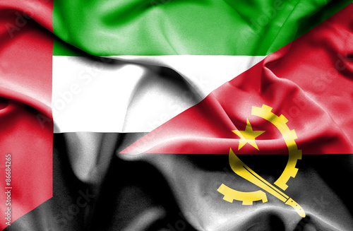 Waving flag of Angola and United Arab Emirates